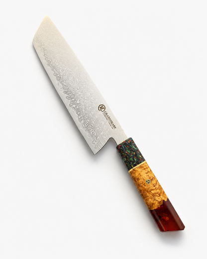 A Japanese-style kitchen knife with a textured Damascus steel blade, featuring a handle with a dark green and orange burl wood inlay and a reddish-brown resin end cap, shown on a light gray background.